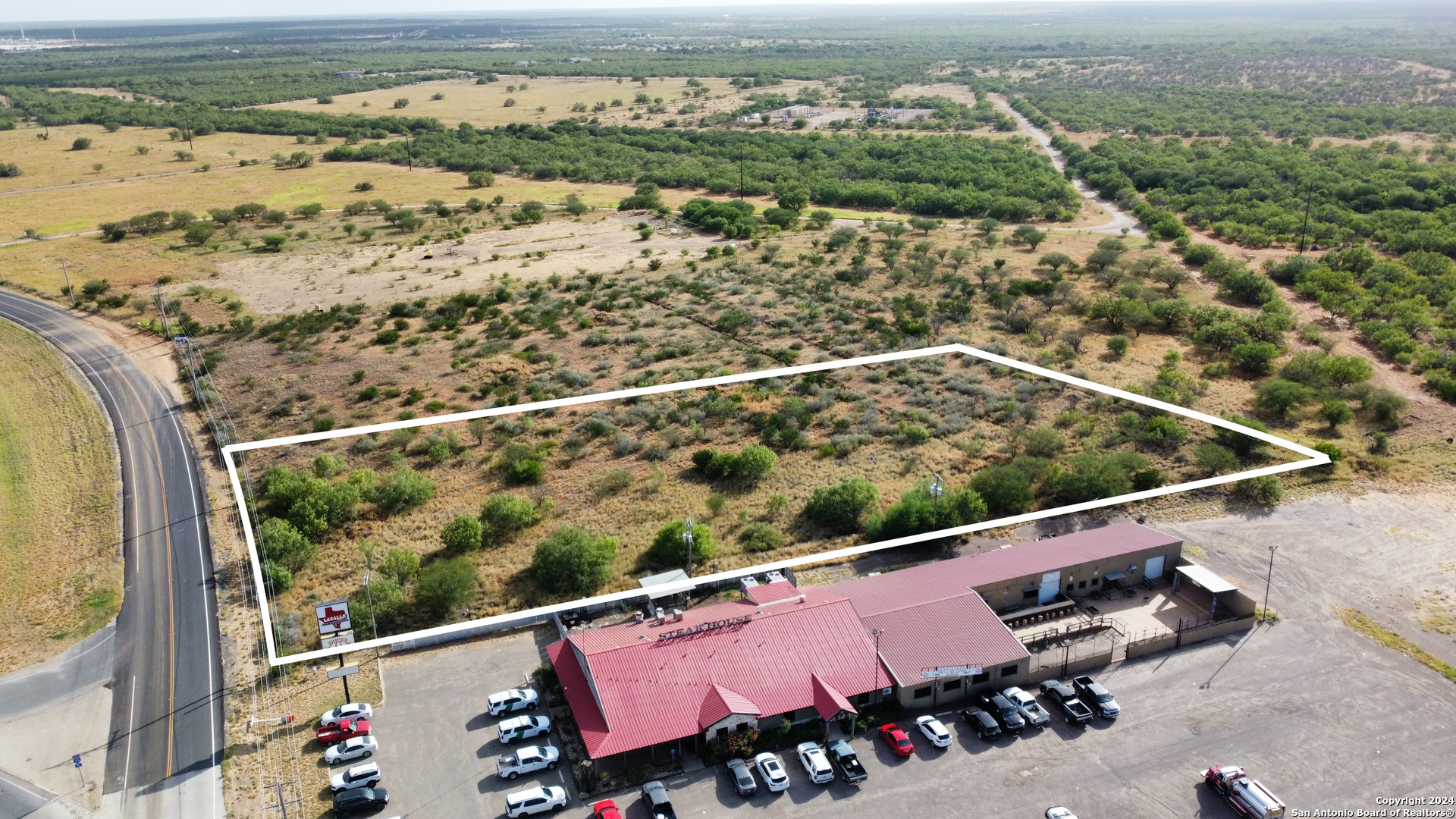 an aerial view of a city with seating area