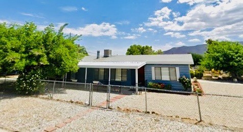 a house view with a backyard space