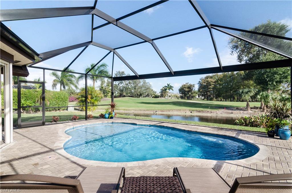 a view of a backyard with a swimming pool