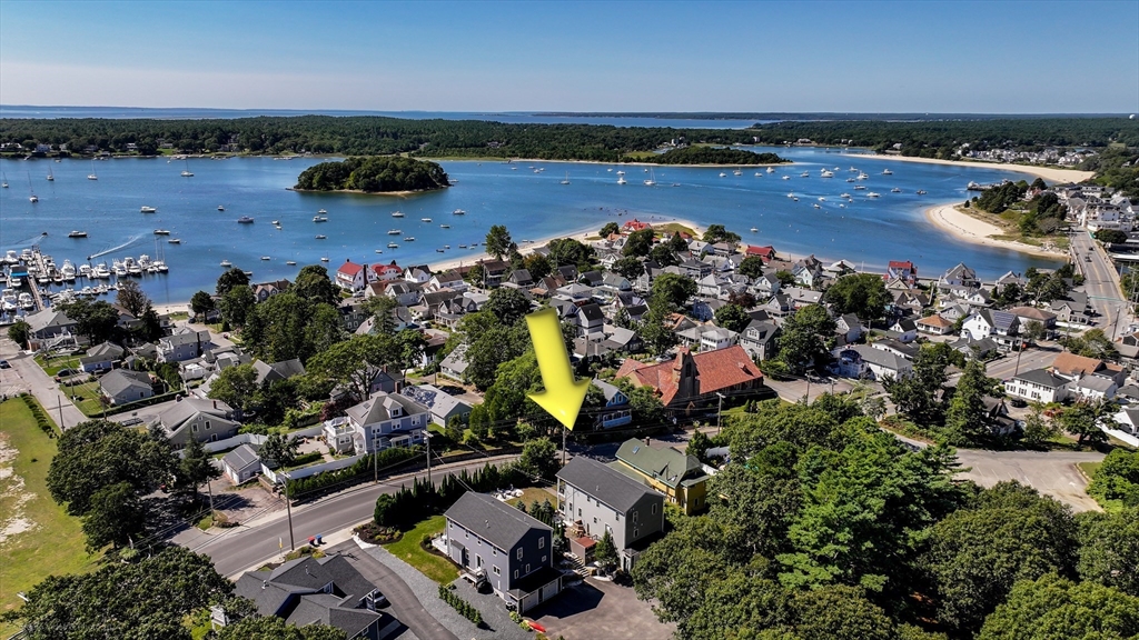 an aerial view of a houses with a lake view