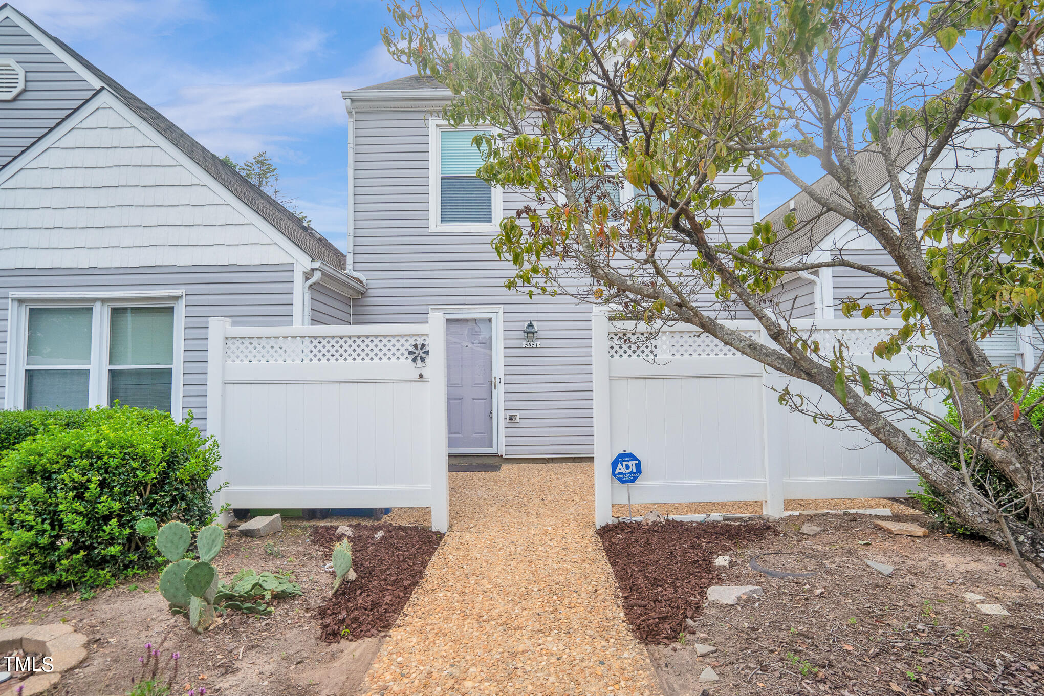 a view of a house with a yard and garage