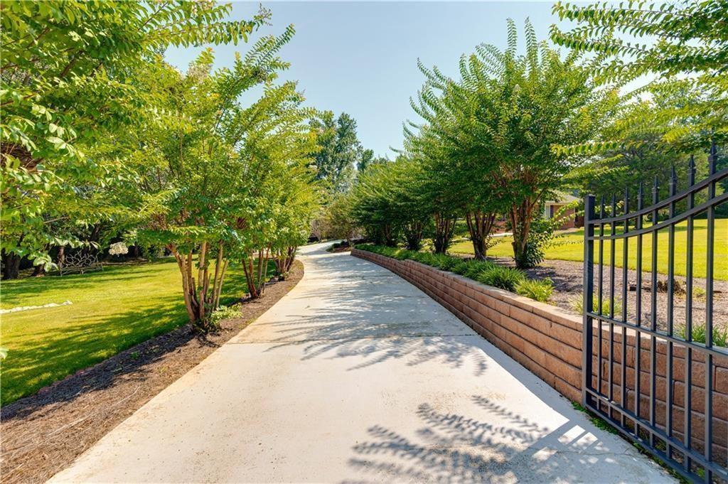 a view of a pathway with a yard