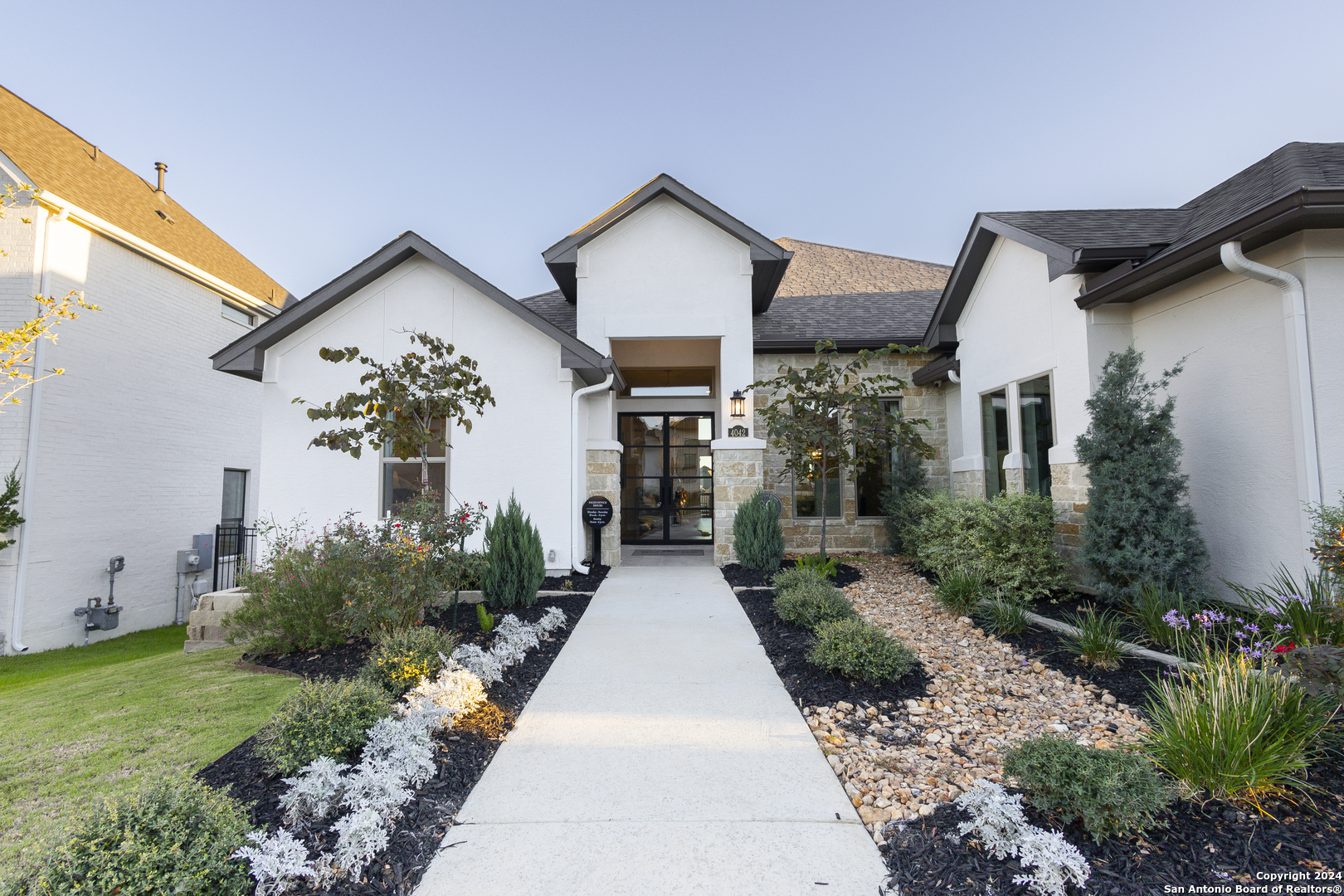 a view of house with yard and green space