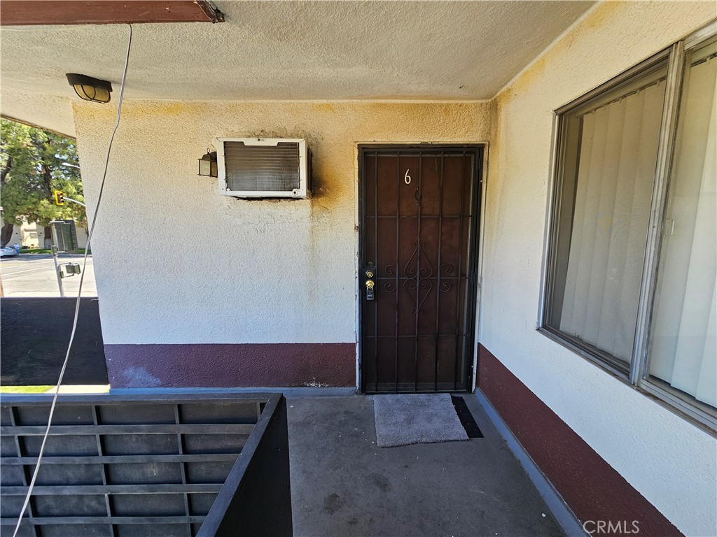 a view of a balcony with door