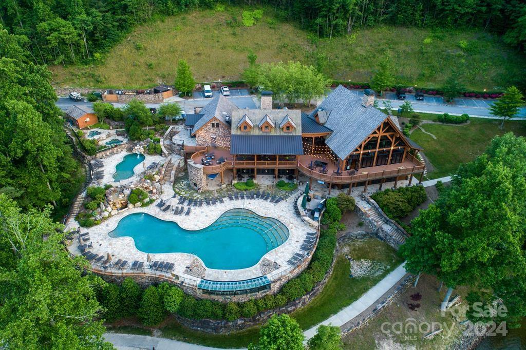 an aerial view of residential house with outdoor space and swimming pool