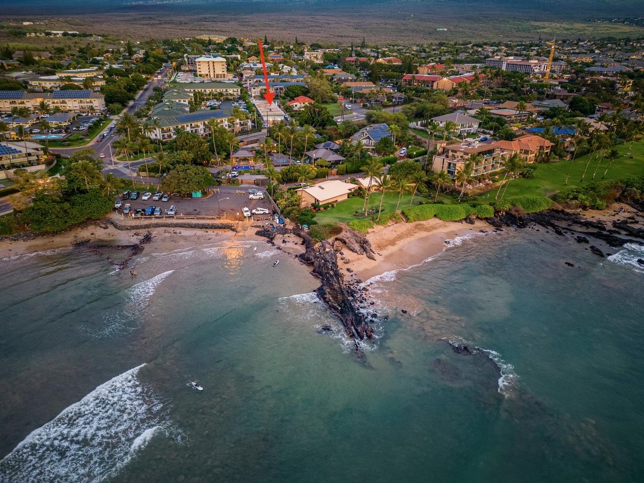 an aerial view of a houses with a yard