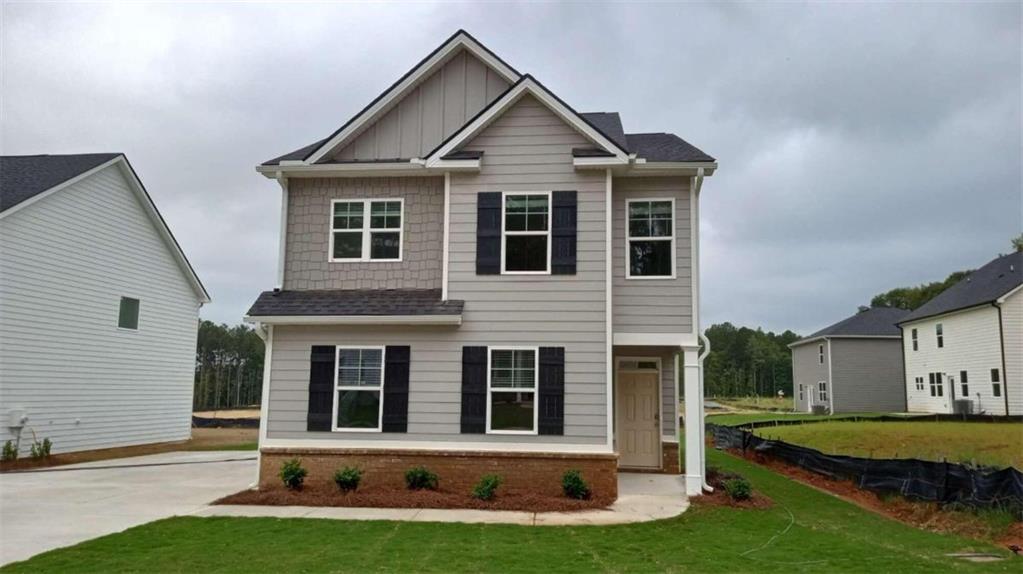 front view of a house with a yard