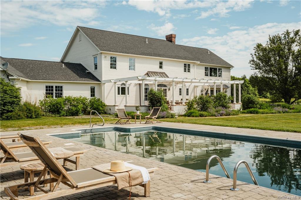 a front view of a house with swimming pool