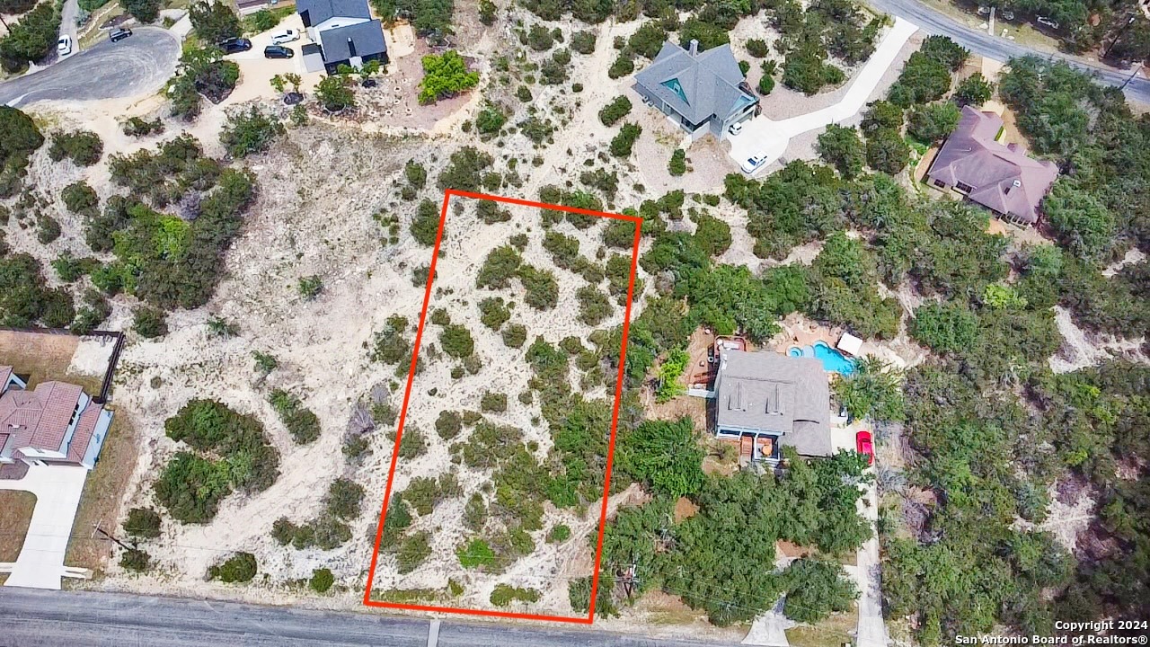 an aerial view of residential house with parking space