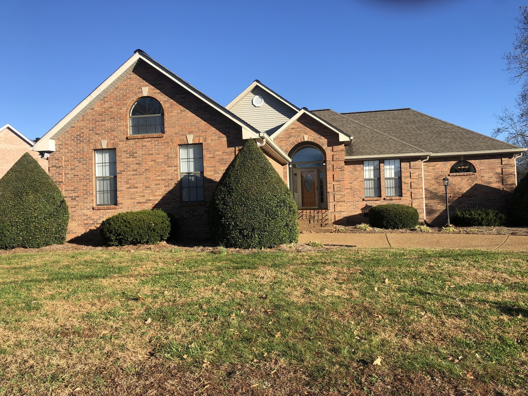 a front view of a house with a yard