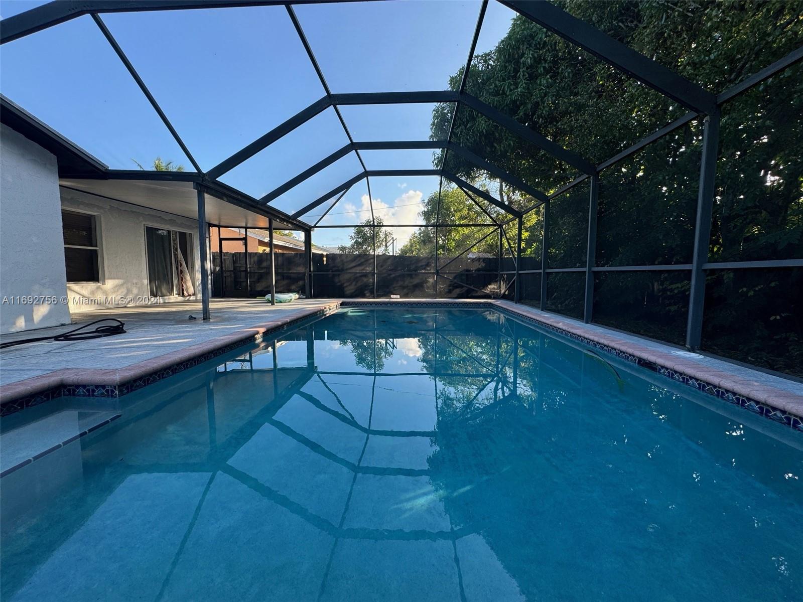 a outdoor space with swimming pool and furniture