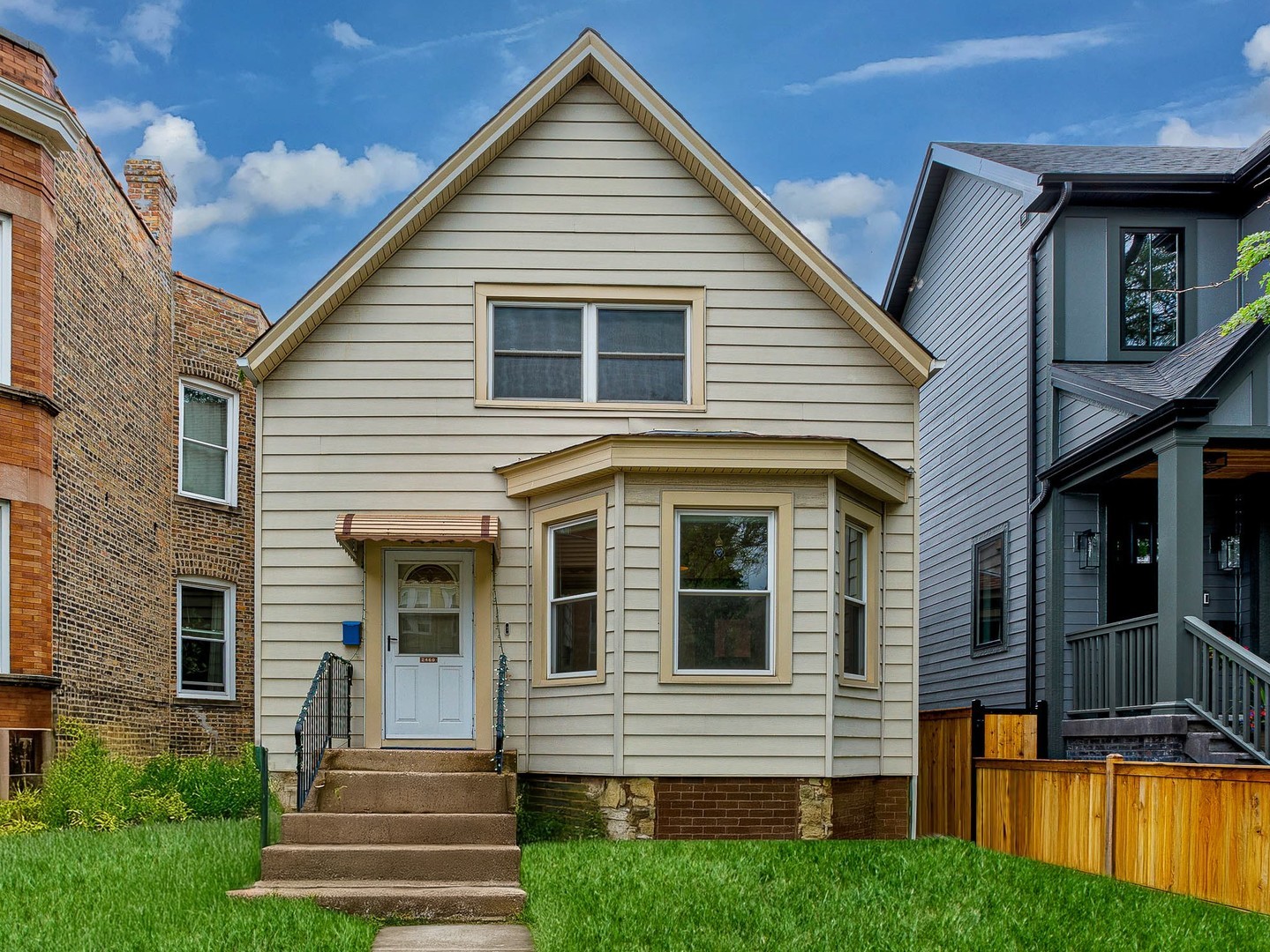 a view of a house with a yard