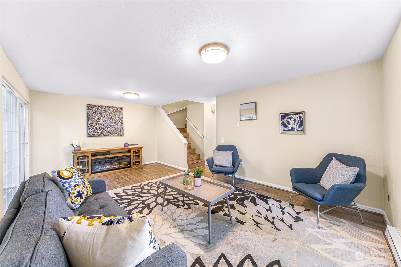 a living room with furniture and a flat screen tv