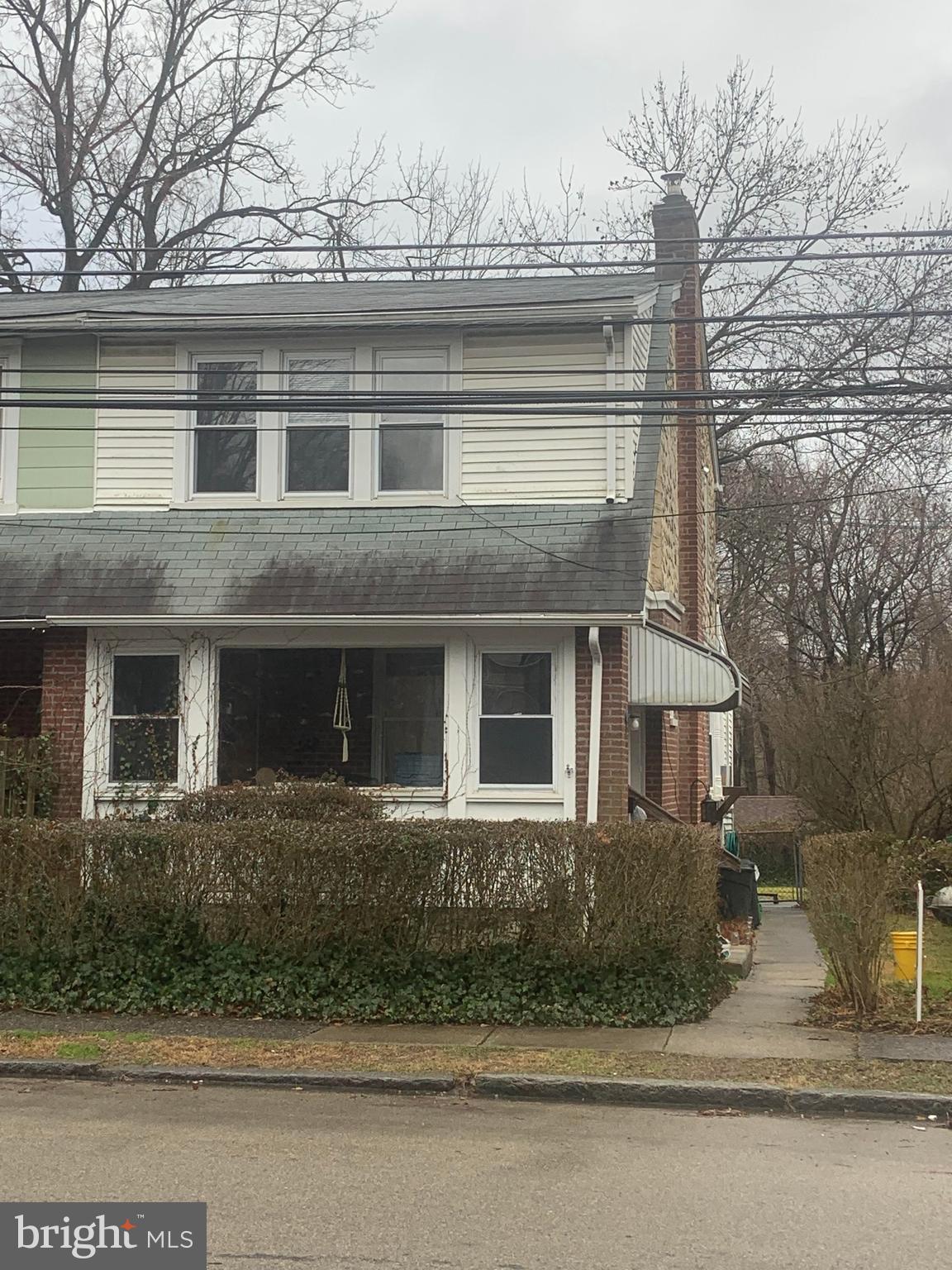 a front view of a house with garage and windows