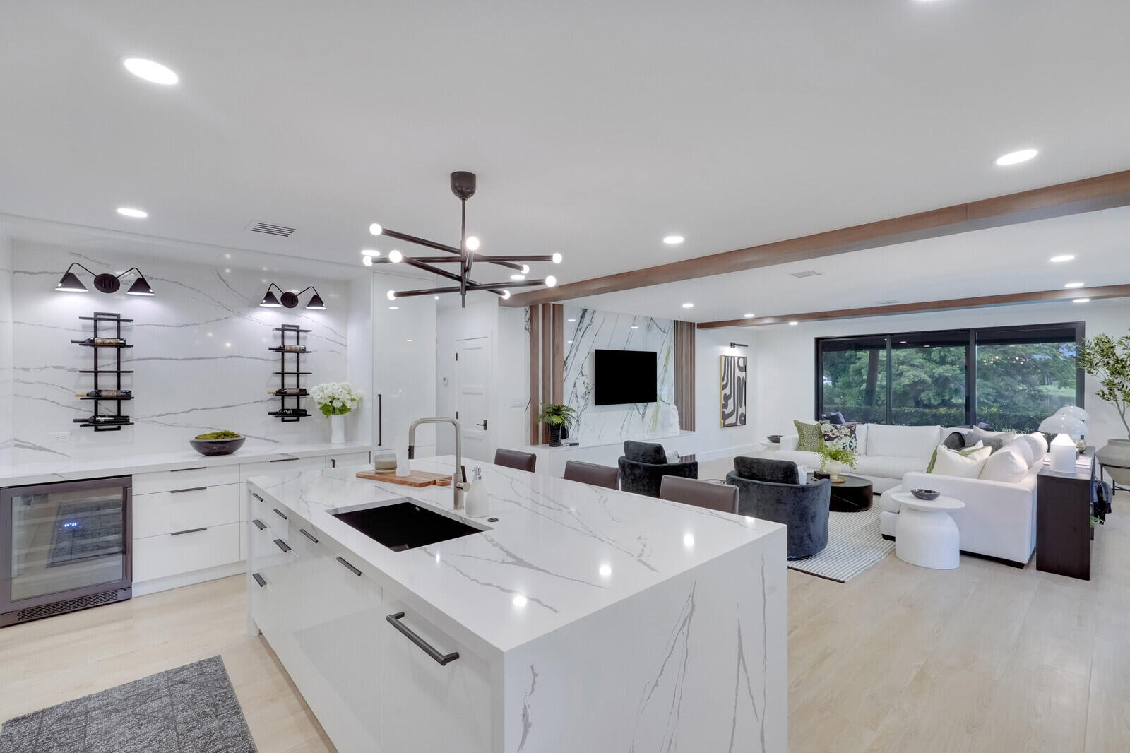 a kitchen with a sink a stove and furniture