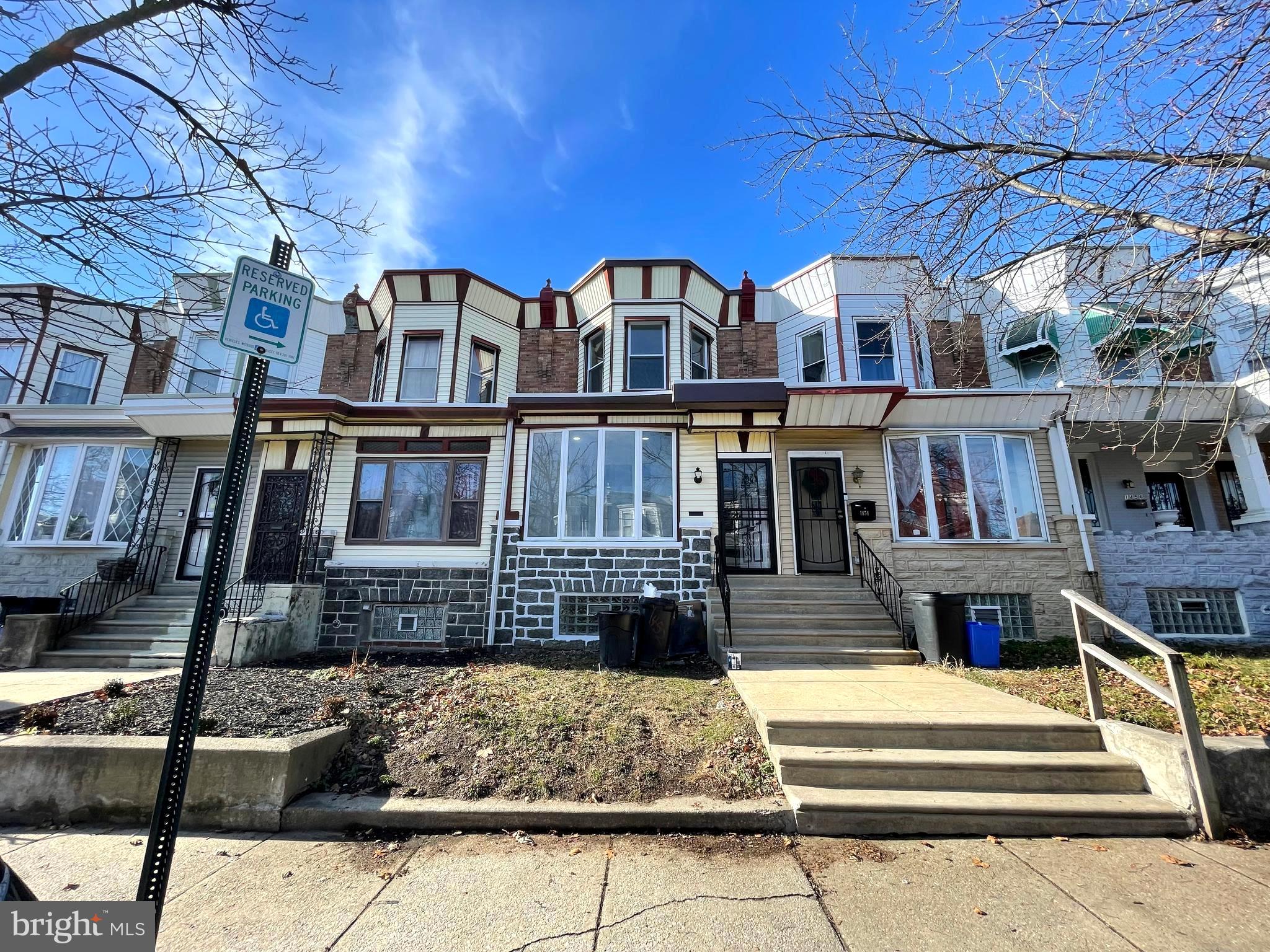 a front view of a building with street view