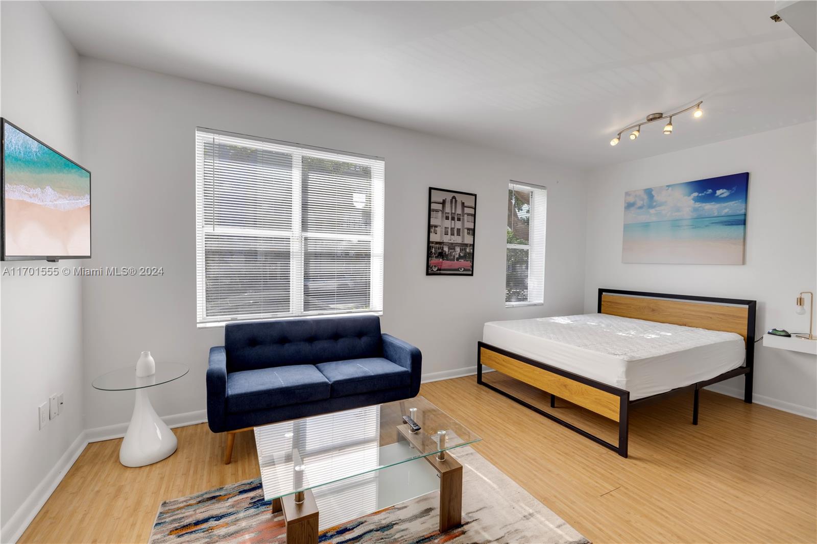 a living room with a couch and a flat screen tv