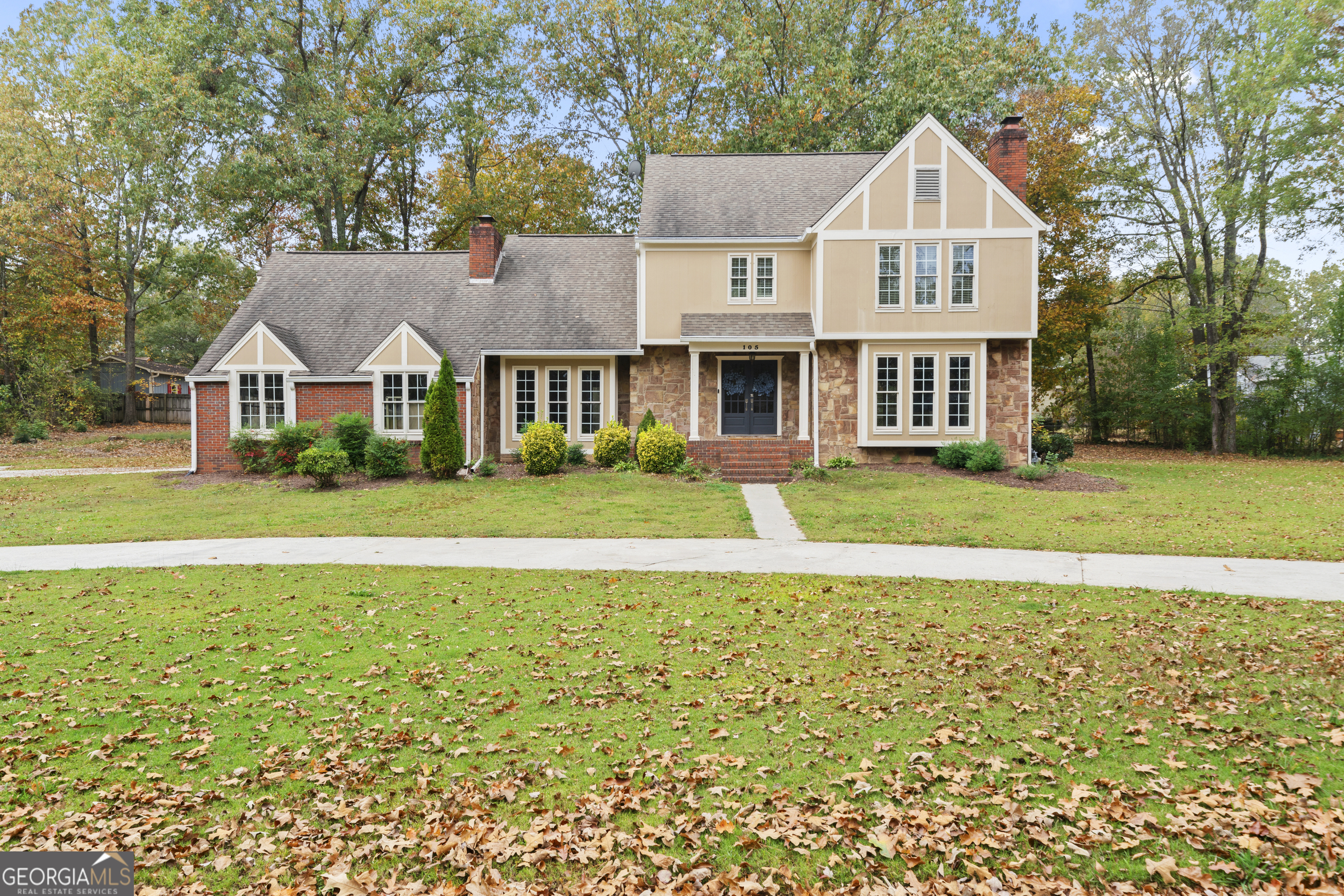 a front view of a house with a yard