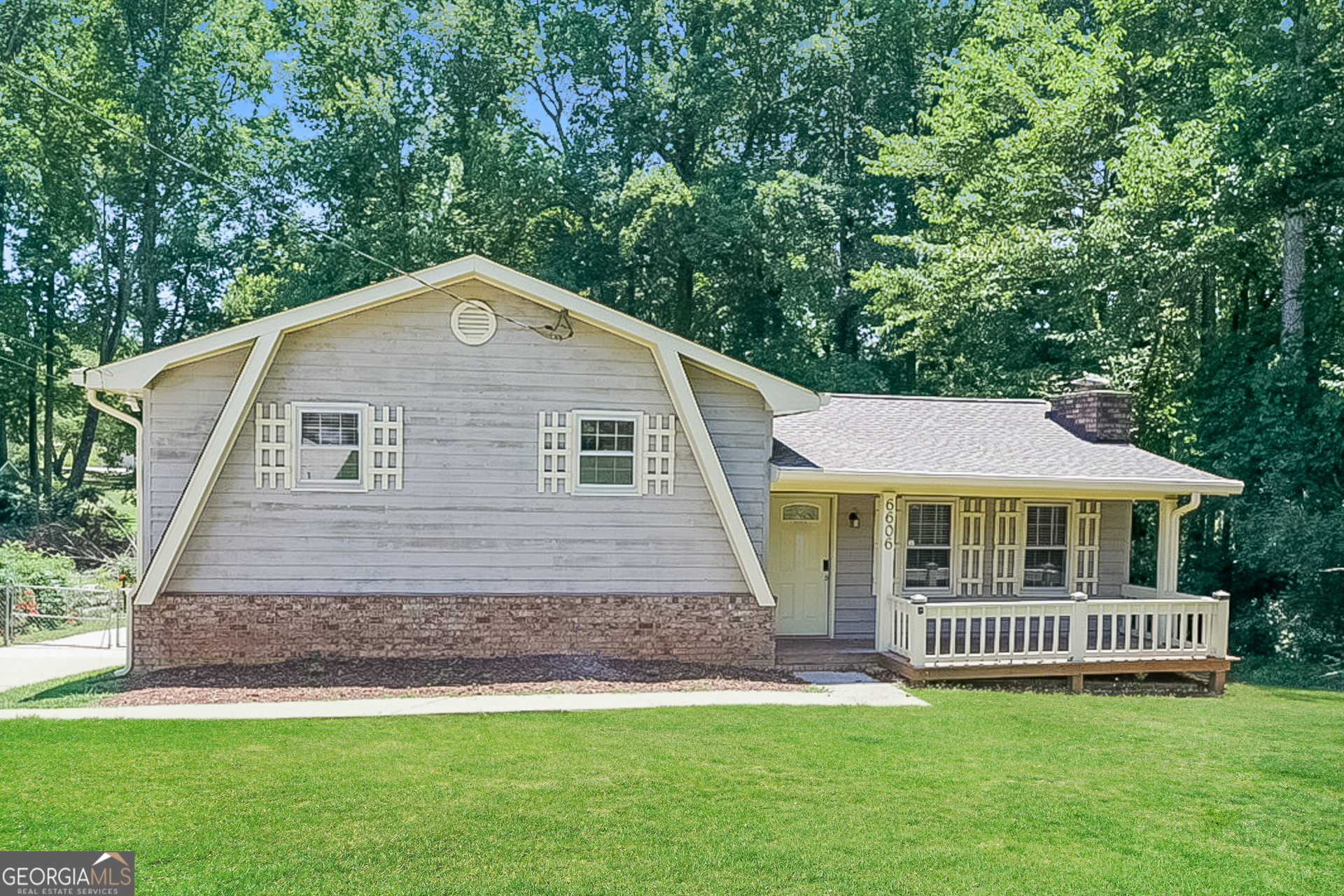 a view of front of house with a yard