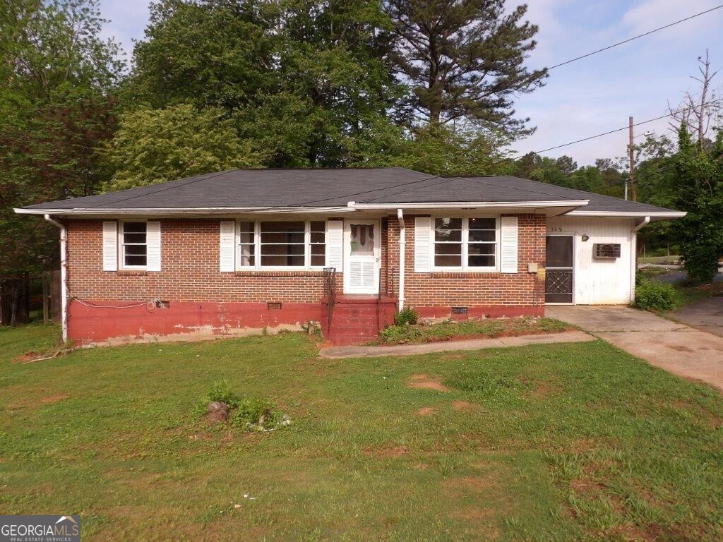 front view of a house with a yard