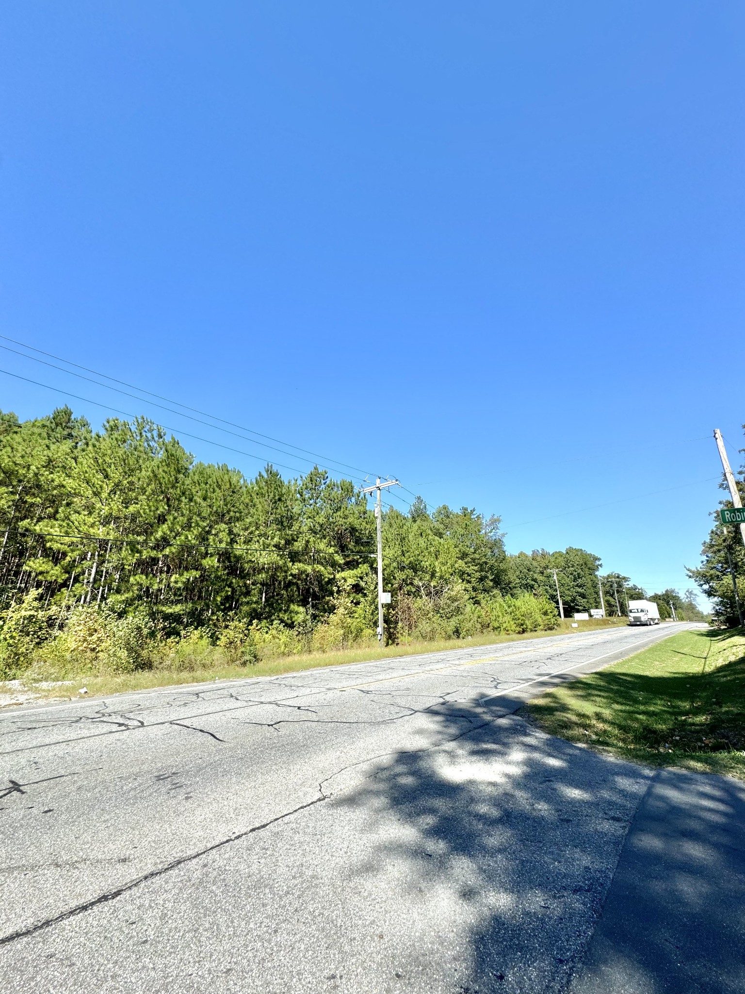 a view of a road with a yard