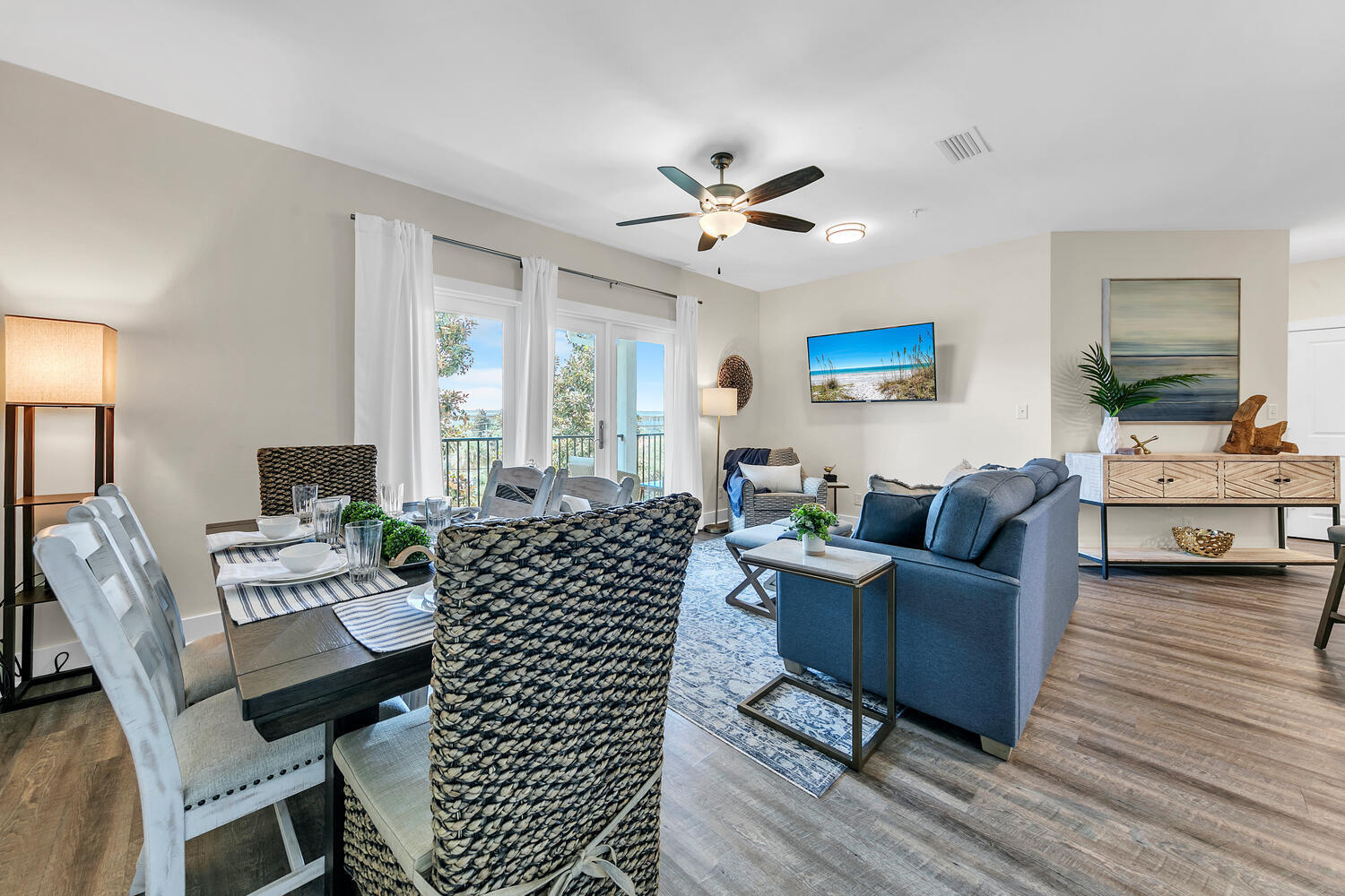 a living room with furniture a fireplace and a table