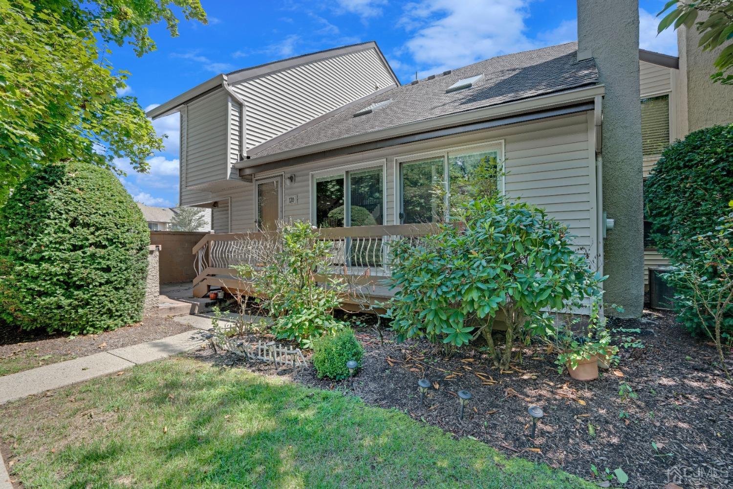 a view of a house with a yard and plants