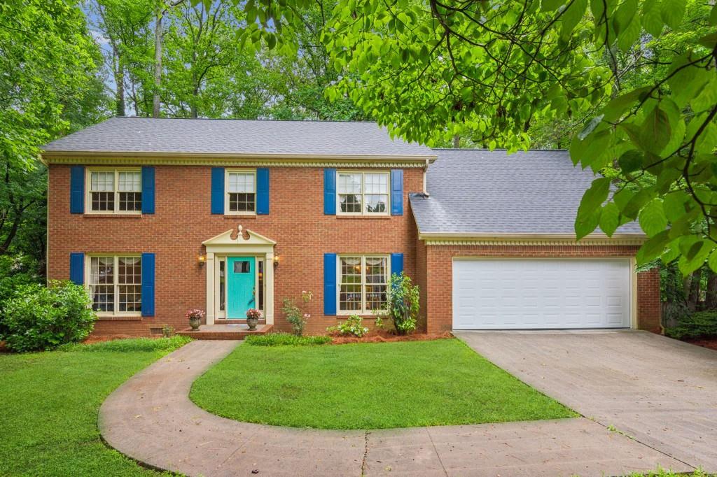 front view of a house with a yard