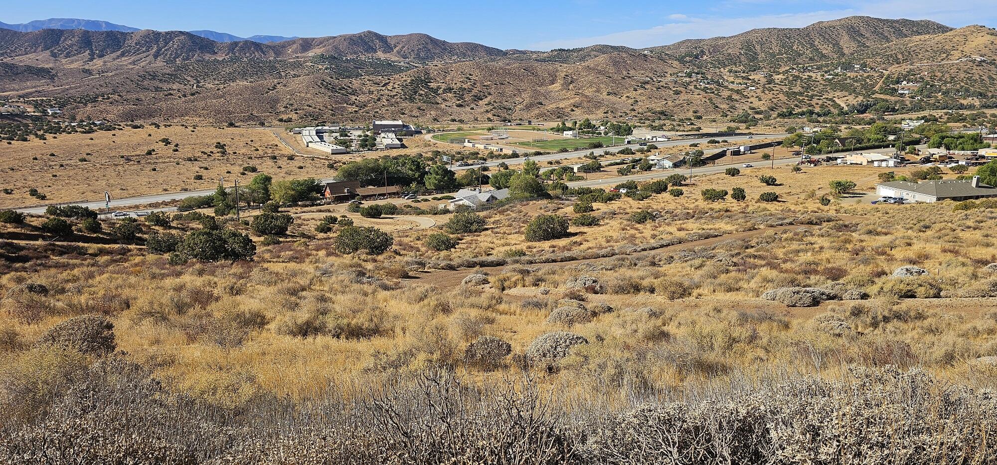 a view of a city with mountains in the background