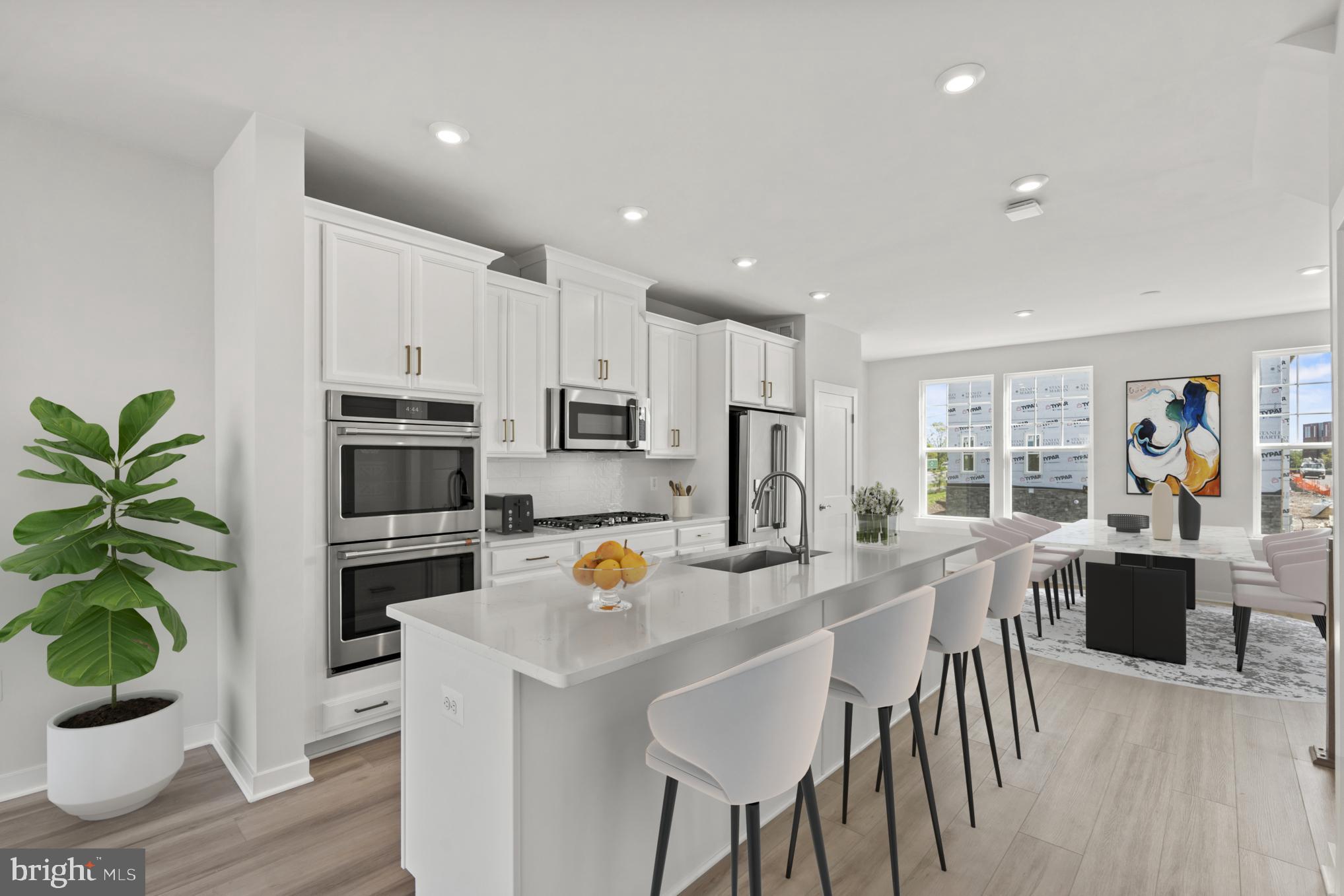 a view of kitchen dining table and chairs