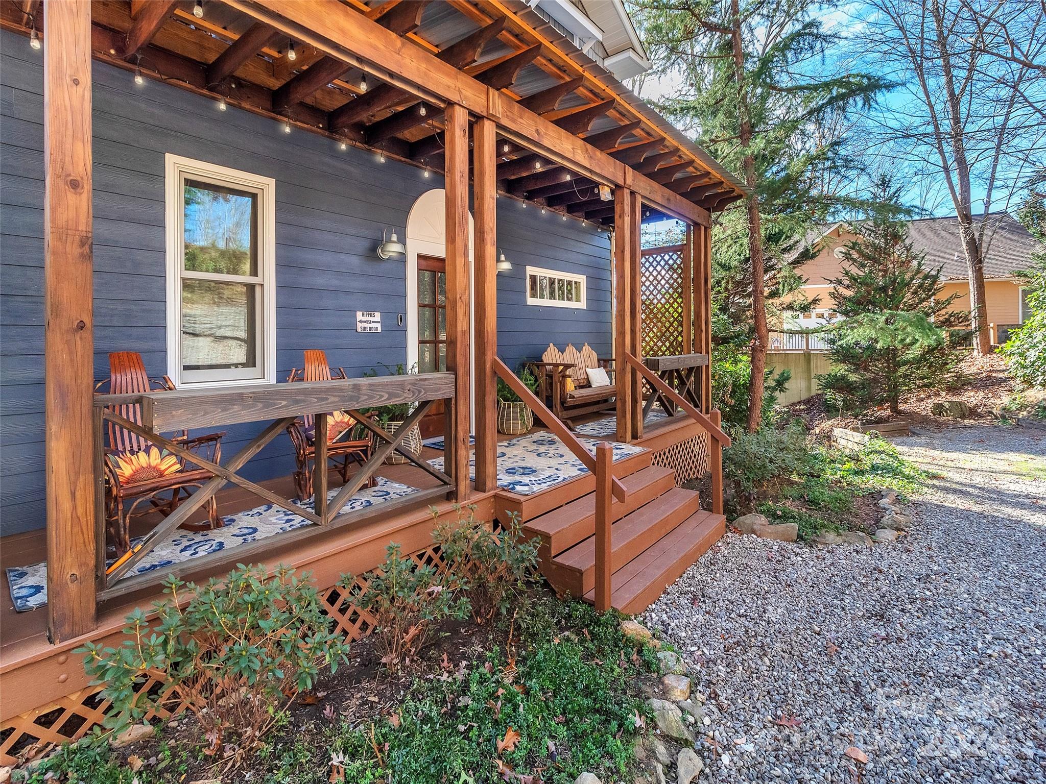 a view of a house with backyard and wooden fence