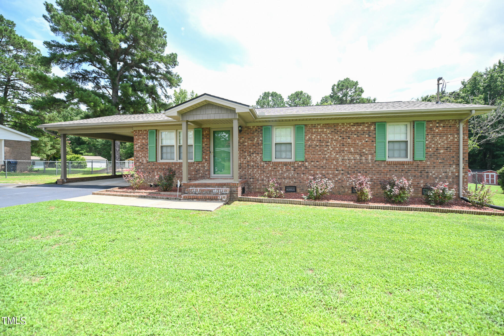 a front view of house with yard and outdoor seating