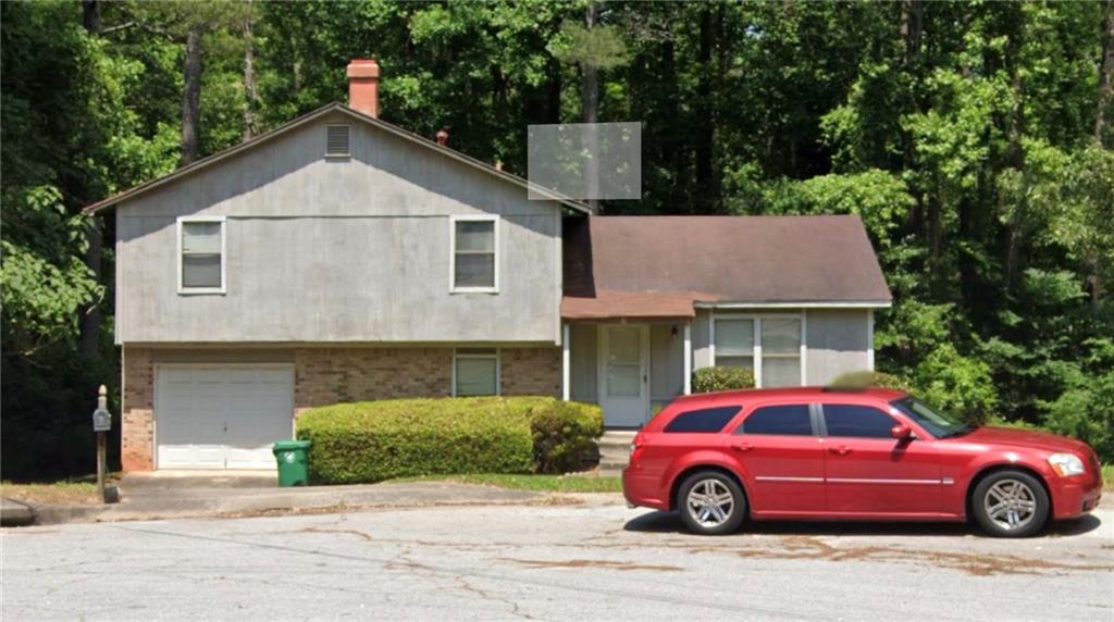 a car parked in front of a house