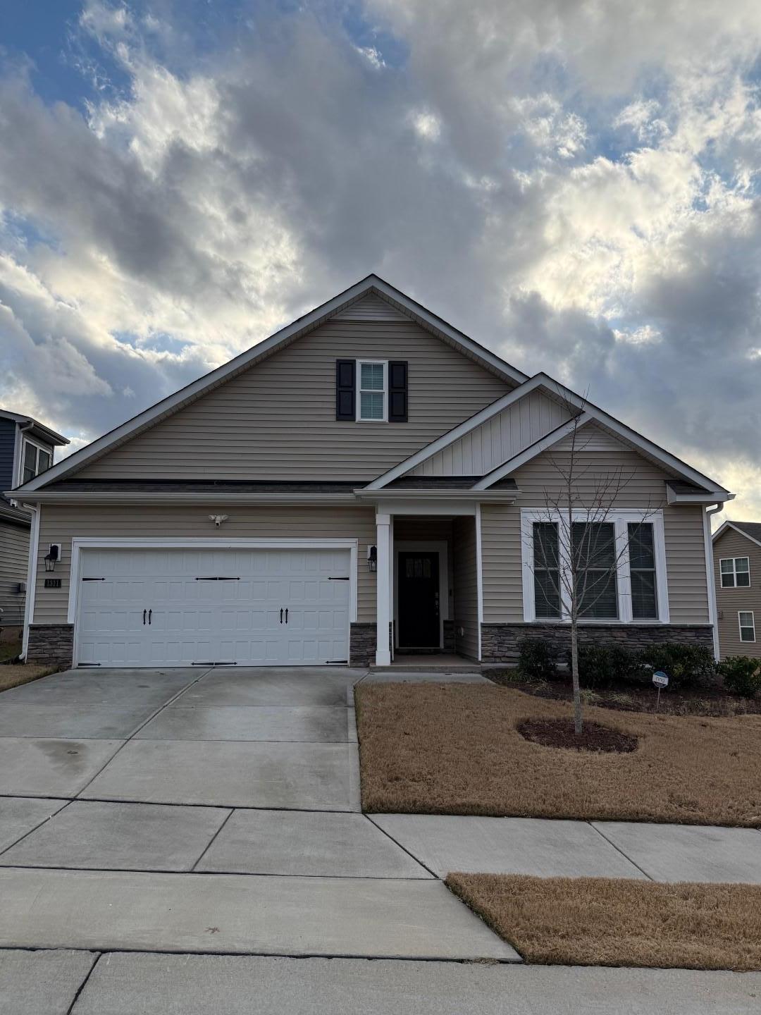 a front view of a house with garage