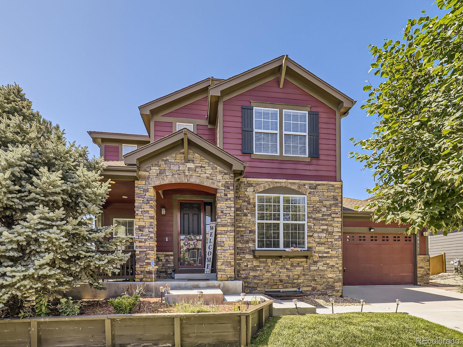 front view of a house with a yard