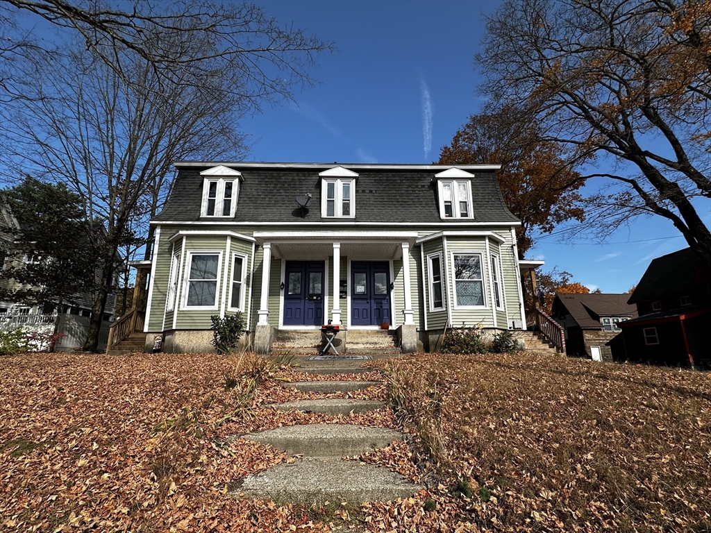 a front view of a house with a yard