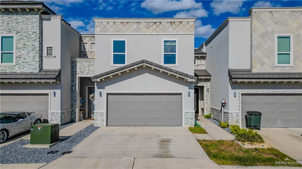 View of property featuring a garage