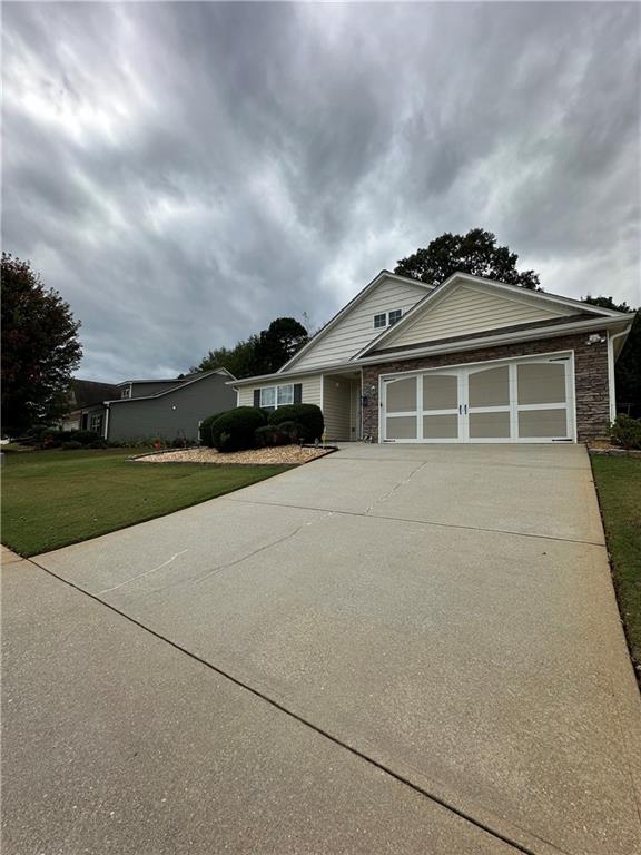 front view of a house with a yard