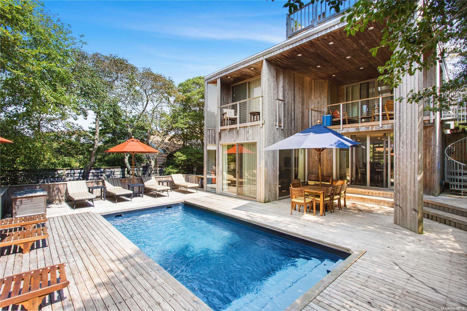 an outdoor space with patio and umbrella