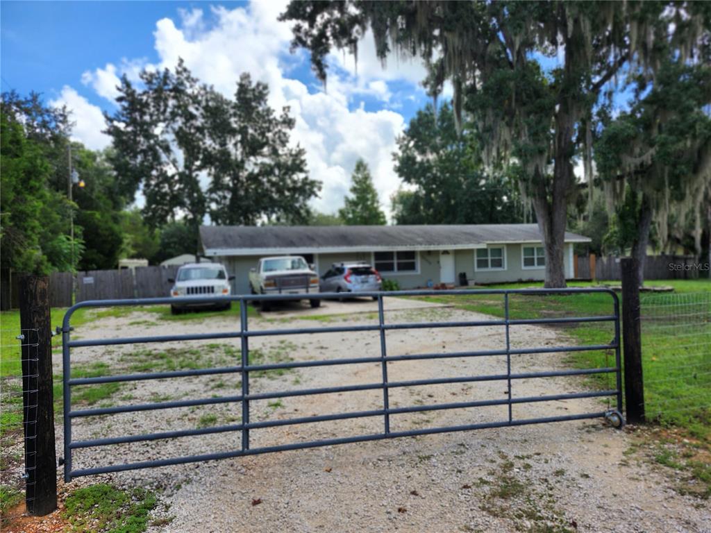 a front view of a house with a fence