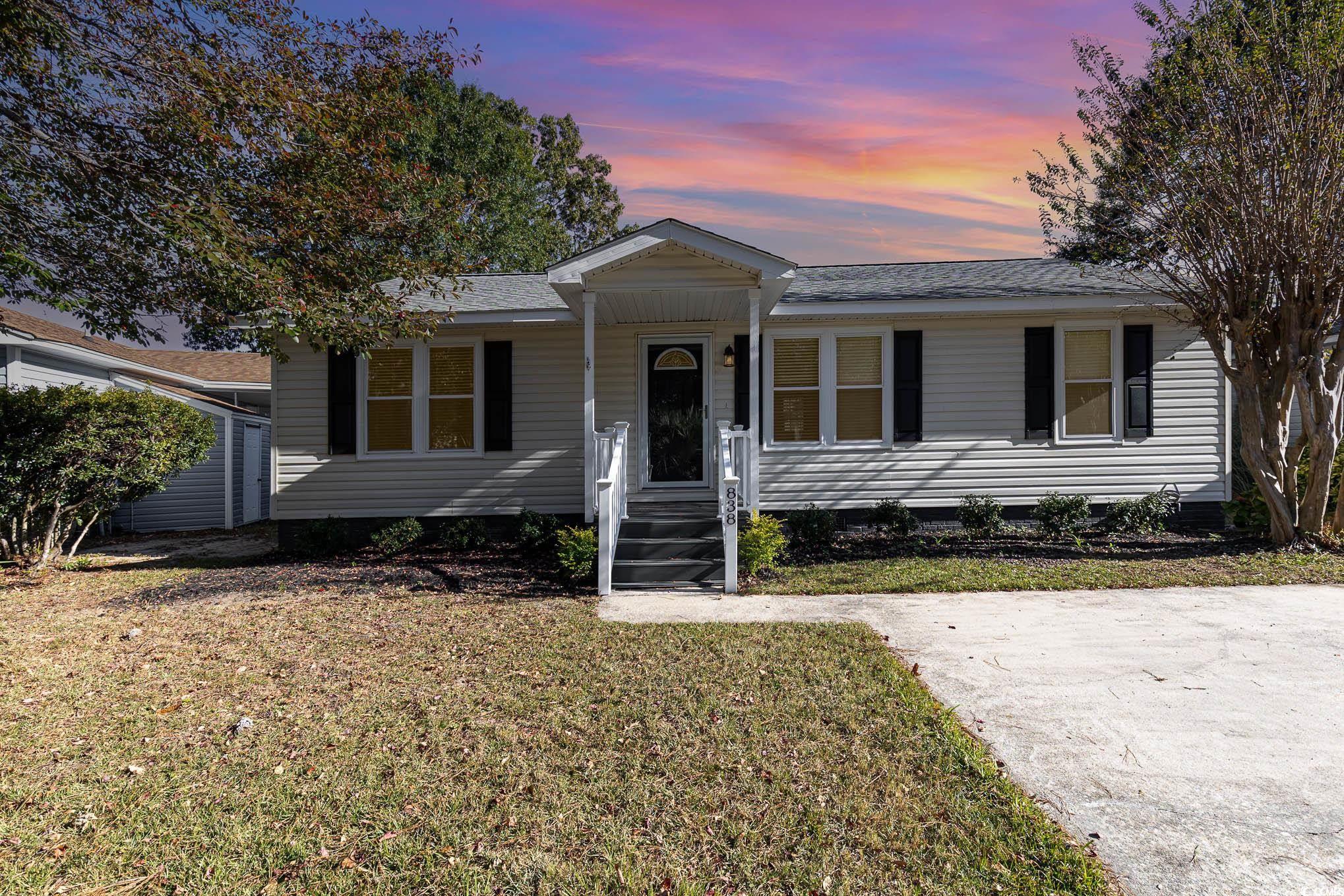 View of front of house with a lawn