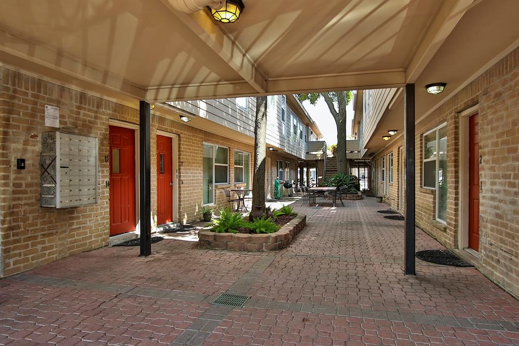 a view of a building with potted plants