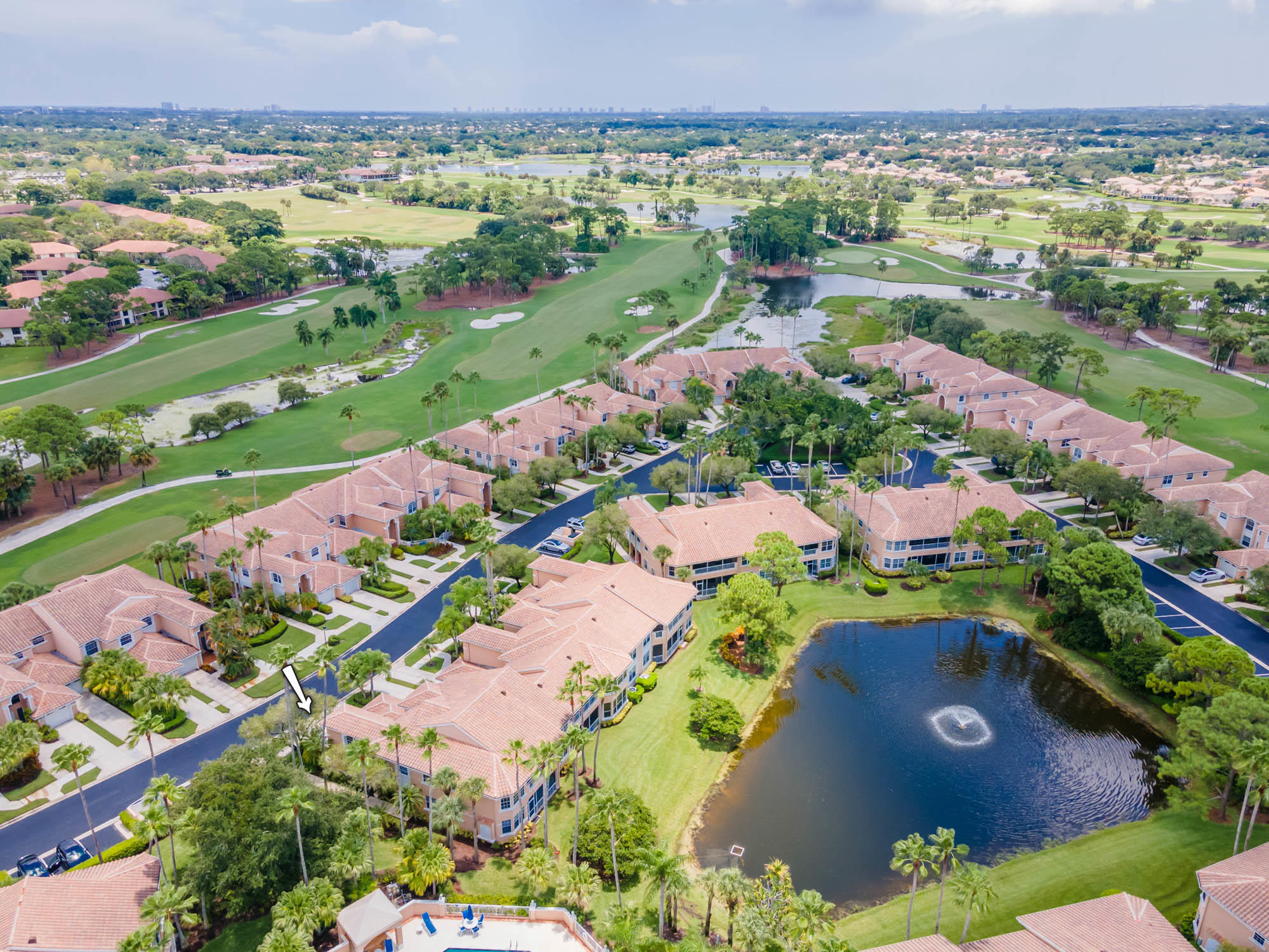 an aerial view of a residential houses with outdoor space and street view