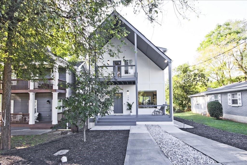 a view of a white house with a outdoor space