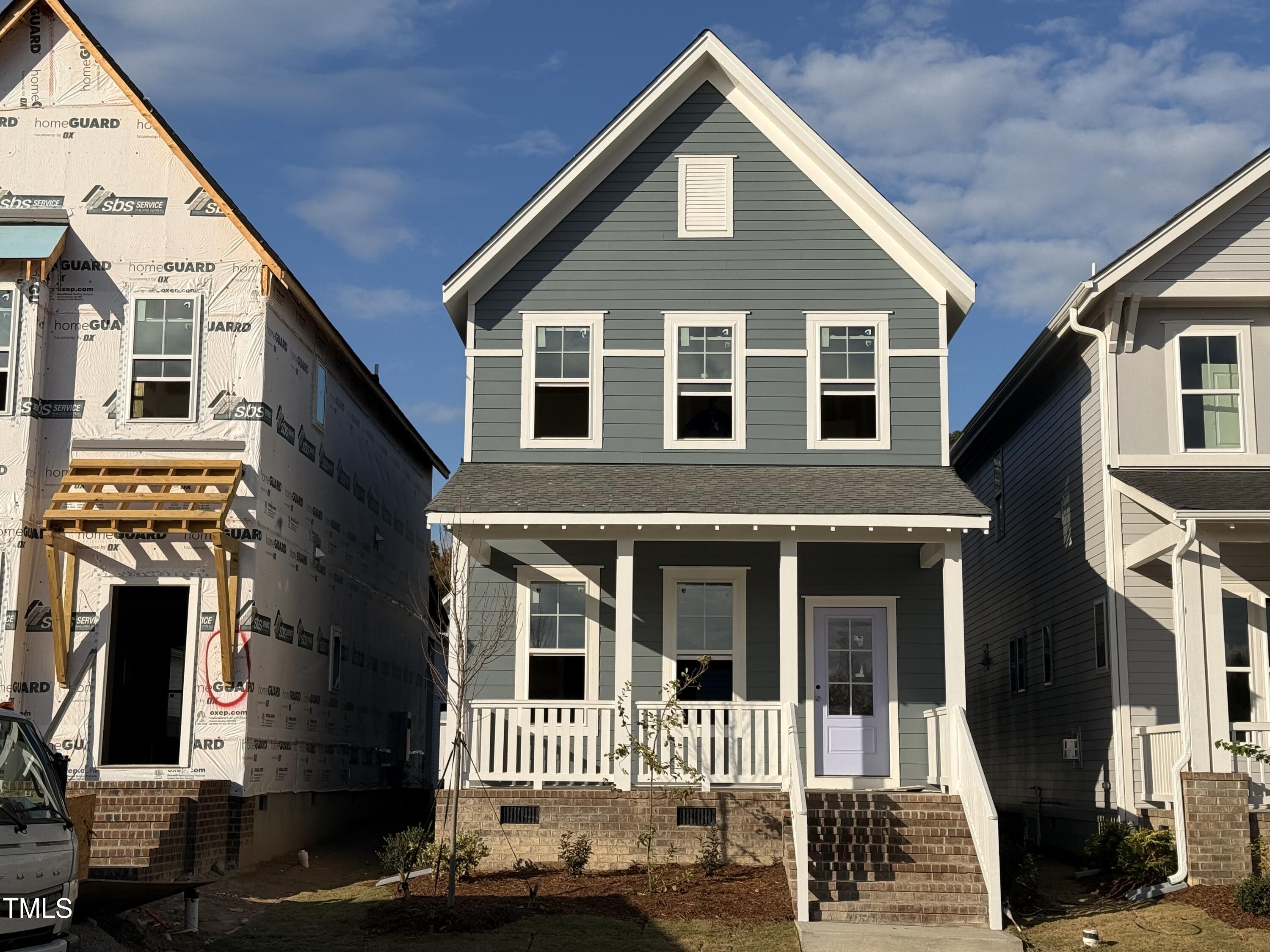 a front view of a house with a porch