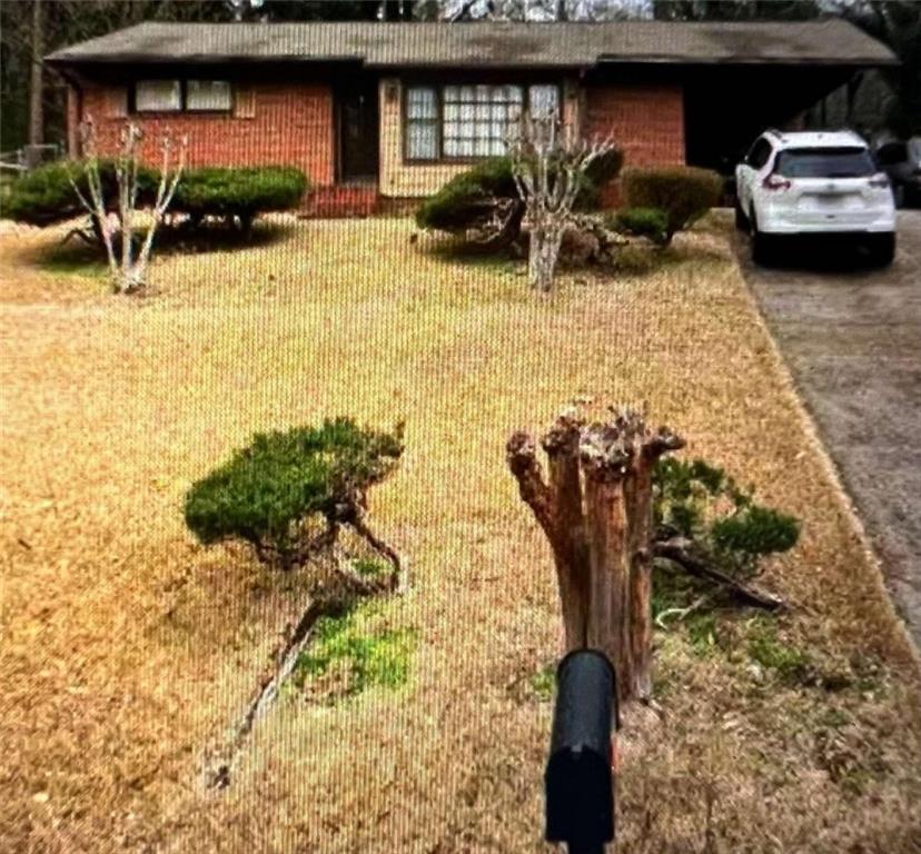 a view of a car parked in the yard