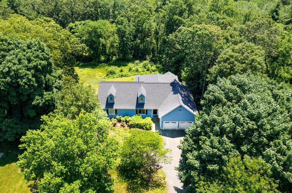 an aerial view of residential house with an outdoor space