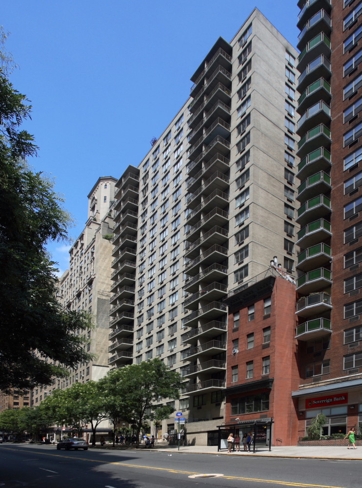 a tall building sitting on the side of a street