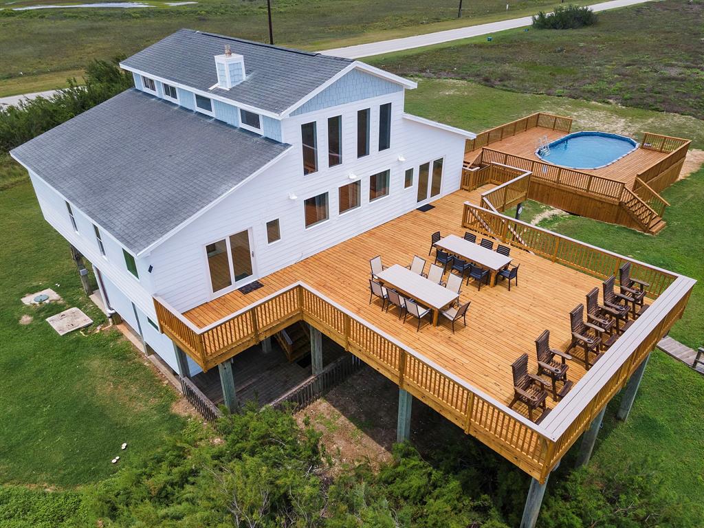 an aerial view of a house with pool