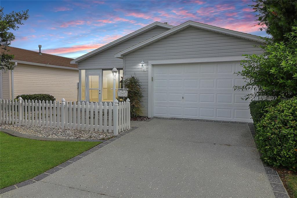 a front view of a house with garage